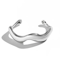 Detailed close-up of a silver irregular wave-shaped cuff bracelet for men on white background - Silver