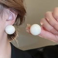 Detail of elegant large white pearl stud earrings shown on model with warm lighting - Large White Round Stud Earring (2# Silver Pin-White) / White