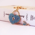 Blue rhinestone heart lock keychain with golden key on elegant white background - Blue