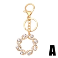 Golden sunburst sunflower keychain with rhinestones and lobster clasp on white background - Style A (Round Hollow Spiral Garland) / Gold