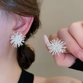 Macro detail of firework-shaped silver earring with central pearl and inlaid cubic zirconia - 14# Silver Pearl Fireworks Style (Silver Pin)