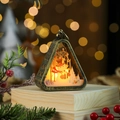 Detail of vintage Christmas lantern with snowman scene and warm glowing LED light - Snowman / Bronze