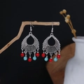 Bohemian silver drop earrings with red and blue beads hanging on a wooden branch - Red Blue Beaded Hollow Teardrop Style (E6137-3)