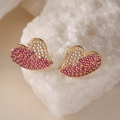 Macro view of 18K gold plated heart studs with pink and white cubic zirconia stones - Gold with Pink and White Zirconia