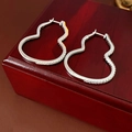 Detailed view of silver gourd-shaped earrings with micro-pave cubic zirconia stones - Gourd Zirconia Ear Buckle