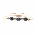 Detail of hand-woven bracelet with deep blue geometric ceramic beads and gold accents - Gold Beads + Royal Blue