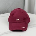 Detail of distressed burgundy baseball cap with white N embroidery and vintage torn effects - Burgundy