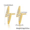 Detailed view of gold plated lightning bolt stud earrings with clear pave set crystals - Flash