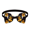 Close-up of dog bowtie with yellow sunflower print on black ribbed fabric and elastic band - Daisy and Sunflower