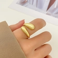 Polished gold adjustable open ring featuring rounded waterdrop ends on model finger - 11 14K Gold Plated Water Drop Ring (12321)