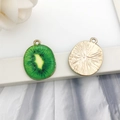 Green and yellow kiwi slice charms in golden alloy finish for DIY jewelry - Round Kiwi Fruit