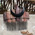 Detailed view of natural amethyst hair comb with black crescent moon and wire wrapping - Strawberry Quartz Black Moon