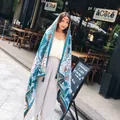 Cotton linen floral beach scarf in lake blue with orange flowers and tassel edge - Lake Blue Floral Style (37105)