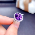 Detailed macro view of an oval purple amethyst ring with white zircon halo on silver band - Adjustable Open / Purple Amethyst Style (Silver Tone)