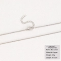 Macro detail of 18k silver box chain necklace with lobster clasp and copper material - Copper / Box Chain / Silver