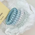 Set of four blue and white spiral telephone wire hair ties in various finishes - 1# Blue 4-Piece Set