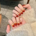 Detail of handmade burgundy cat eye press-on nails with starry gradient shimmer effect - Extra Small (XS) / Short Oval (2721)