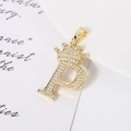 Close-up of gold-plated letter P pendant with crown design and sparkling cubic zirconia - Letter P