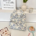 Off-white canvas tote bag with blue floral pattern and stylish shoulder straps - Blue Floral