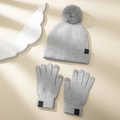 Detail view of winter knitted set featuring a gray beanie with pompom and matching gloves - One Size / Light Gray