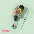 Cat teaser toy attachment with 3.5cm natural feathers and silver bell on green background - No. 10 Insect Replacement Head