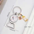 Detailed view of silver letter M beer bottle opener with charm pendants and dimensions - M