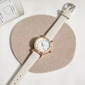 Women's quartz watch with white leather strap and rose gold Roman dial on felt mat - Gray