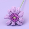 Detail shot of a handmade crochet gerbera flower in light purple with a green stem - Cute Afghan African Daisy Branch - Purple