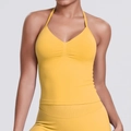 Detailed texture of seamless yellow ribbed fabric on this halter yoga sports top - Yellow
