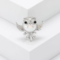 Exquisite owl brooch with pearl and colorful rhinestones on a minimalist white pedestal - Silver