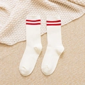 White cotton mid-calf socks with red stripes and ribbed texture on a cozy blanket - One Size / White Red