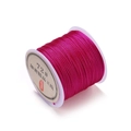 Detail view of 0.8mm rose red jade cord roll for DIY jewelry and knotting - Deep Rose Red