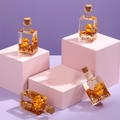 Bouteille en verre liquide de chat chanceux avec paillettes d'étoiles dorées - Série Chat de la Fortune