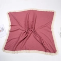 Close-up of pink muslin baby blanket with natural crinkle texture and tassel fringe - 100*120 cm / Deep Pink
