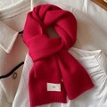 Minimalist red knitted scarf with 'emo' tag on white apparel background - China Red