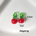 Pair of red glass cherry pendants with green stems for DIY jewelry making and crafts - Apple