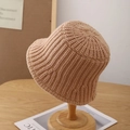 Detail of warm beige knit bucket hat with thick vertical stripe texture on a wood stand - Adjustable / Khaki