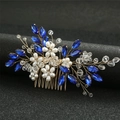 Close-up of golden bridal hair comb with blue water-drop crystals and white pearls - Blue/Gold