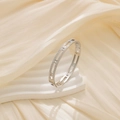 Macro detail of silver bangle with Roman numeral cutout and pave set zircon stones - Steel Color Female Style