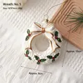 White Christmas wreath ornament with red berries, gold bow, and festive hanging string - Wreath: Style 5