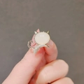 Elegant gold cat brooch featuring milky cat eye stone and sparkling white zirconia accents - Kitten Style (90246F)