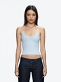 Light blue halter neck tank top paired with dark denim jeans in a minimalist fashion style - Baby Blue