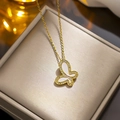 Titanium butterfly necklace with white shell inlay and crystals on a luxury jewelry box - White Shell Butterfly Necklace Gold