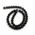 Macro shot of matte black round beads with a frosted texture for DIY jewelry making - 4mm Approximately 98 Beads Per String / Matte Black
