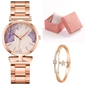 Detail of rose gold watch with palm leaf dial, star charm bracelet, and pink gift box - Purple + Bracelet + Box