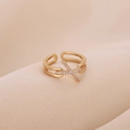 Elegant gold-plated adjustable cross ring with zircon stones on soft beige fabric - Cross Inlaid Zircon Style (D7318) / Gold