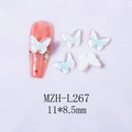 Macro detail of butterfly nail art charms 11x8.5mm with iridescent pearl finish - Butterfly - White Mocha (L267)