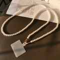 Elegant white pearl crossbody phone lanyard with gold metal clasp and clear connector - Crossbody Simple Pearl Lanyard + Translucent Patch