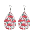 Detail of teardrop leather earrings featuring red truck and Christmas tree prints - White Base Christmas Truck Print