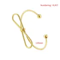 Detail of 1.85mm thick gold-plated twisted bow bangle with elegant snake texture - Gold Style (Snake Texture)